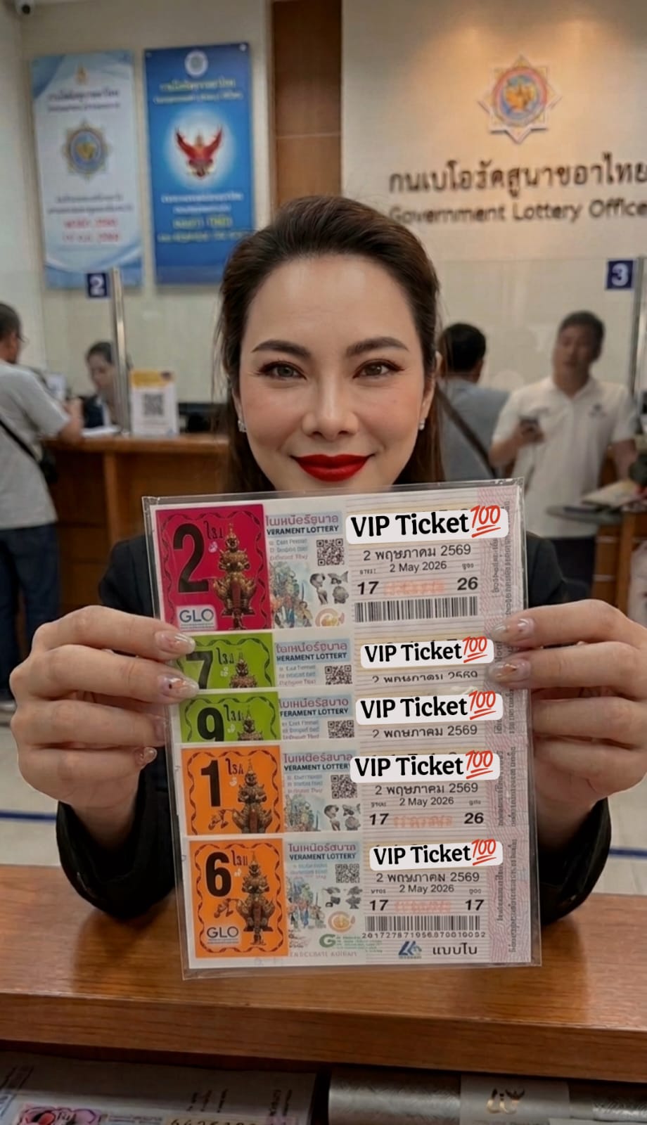 Muyai Bela at Government Lottery Office holding VIP tickets